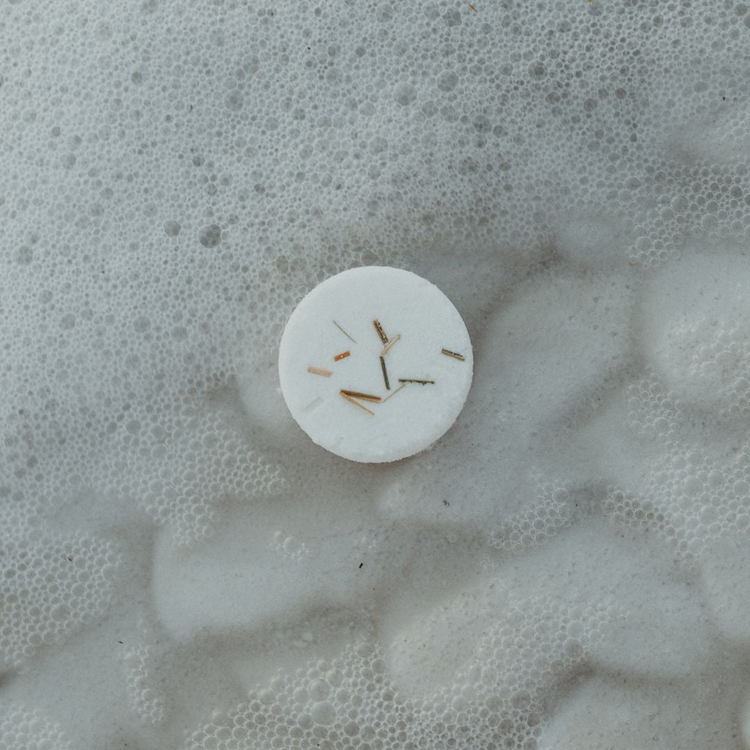 The Dead Sea Co. Clarity Aromatherapy Shower Steamer on the shore of the Dead Sea Jordan