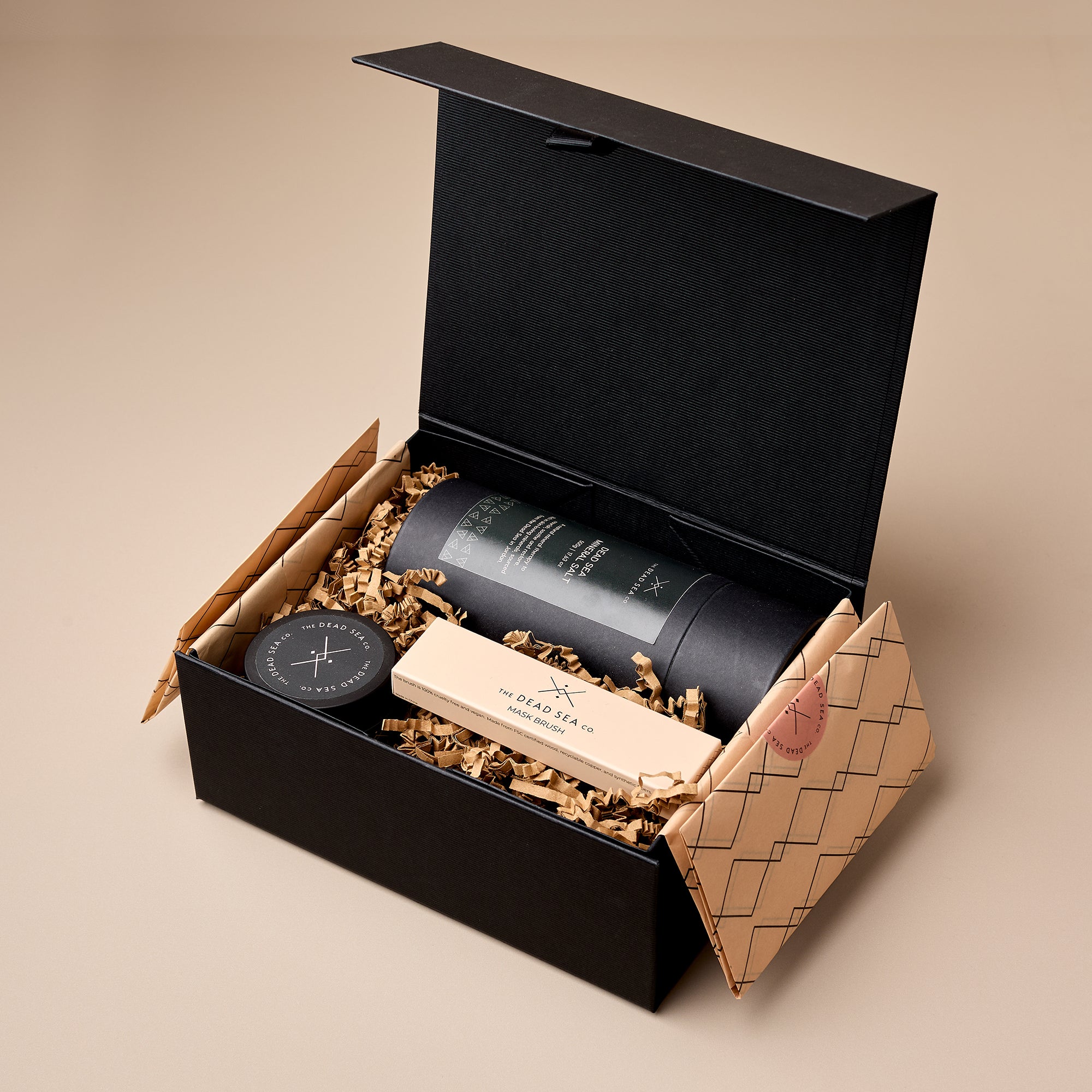 The Dead Sea Co. Mineral Ritual Spa Set in luxury black gift box—includes Dead Sea mineral salt, mineral mask, and application brush, sustainably packaged for premium skincare and wellness gifting.