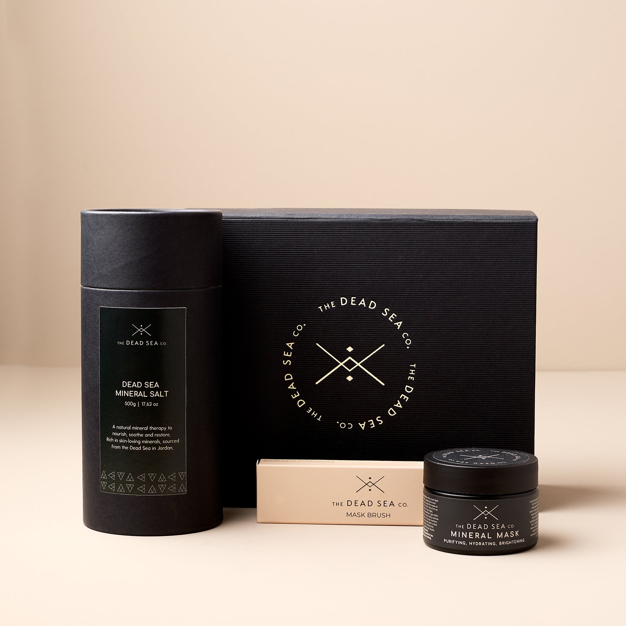 The Dead Sea Co. Mineral Ritual Spa Set including Dead Sea mineral salt, mud mask, and mask brush, premium skincare gift set promoting holistic wellness and clean beauty.