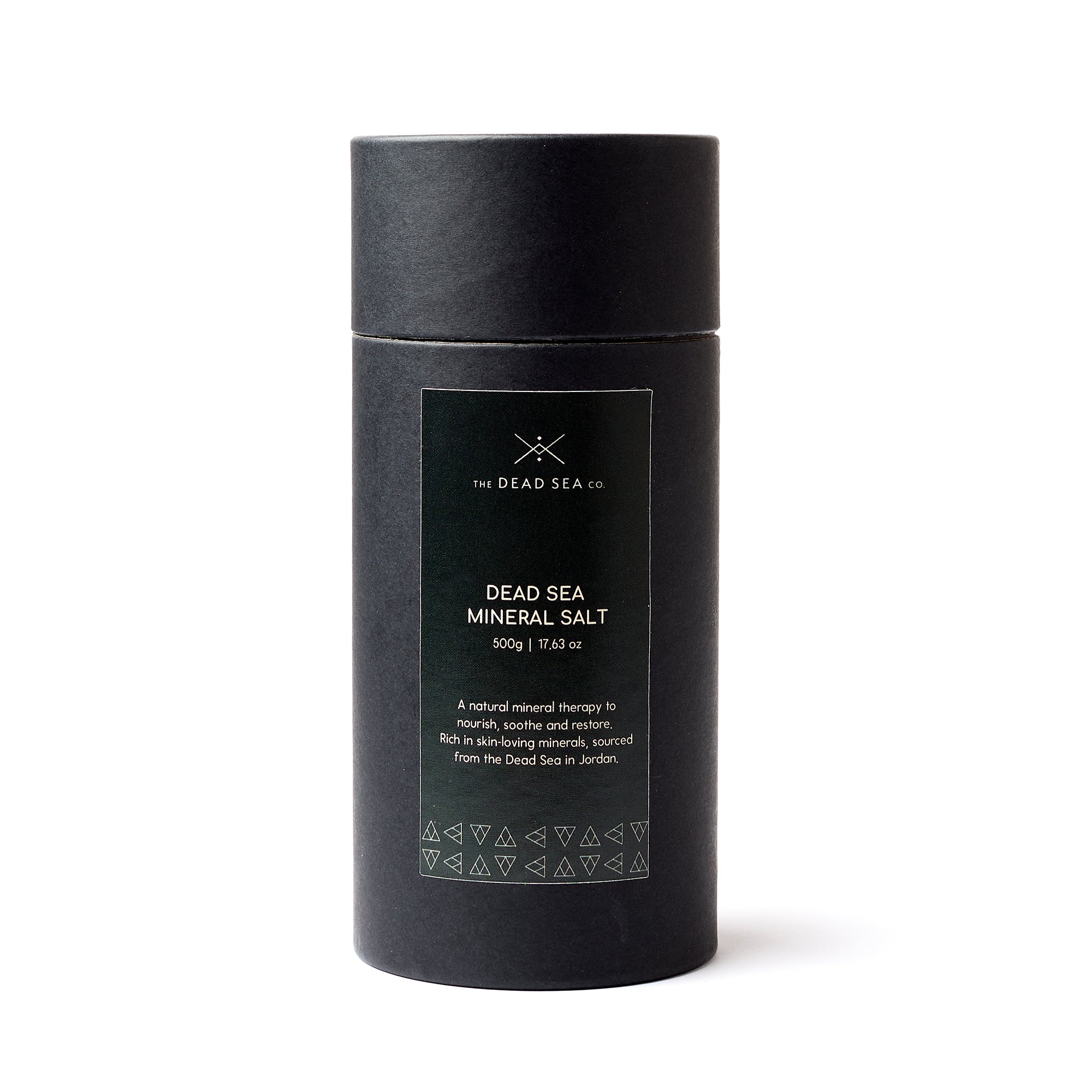 Front view of The Dead Sea Co. Dead Sea Mineral Salt in a premium black tube, labelled with product name and benefits.