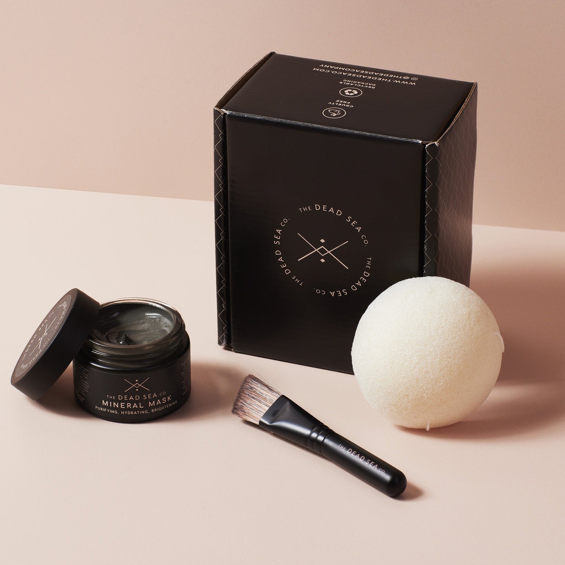 Dead Sea Self-care kit next to an elegant branded gift box