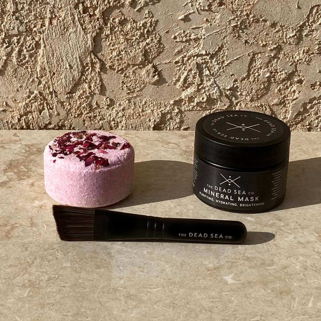 Get the glow set featuring face mask and brush and rose bath bomb