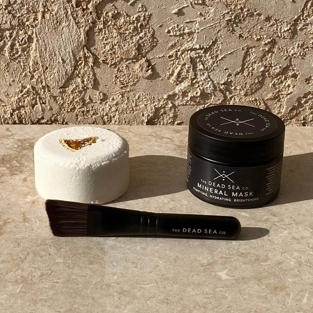 Dead Sea mud mask with citrus bath bomb and face mask brush