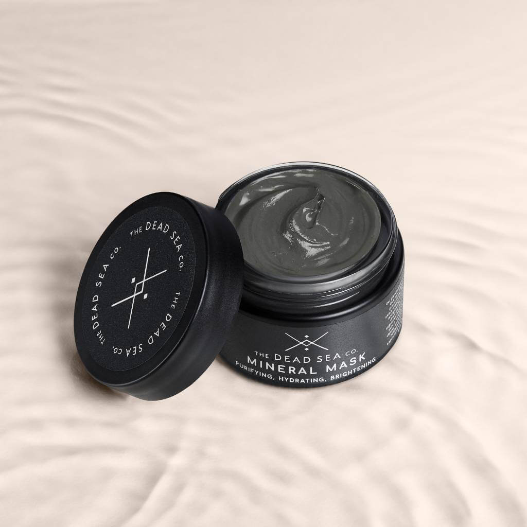 Dead Sea face mask with open lid showing creamy texture