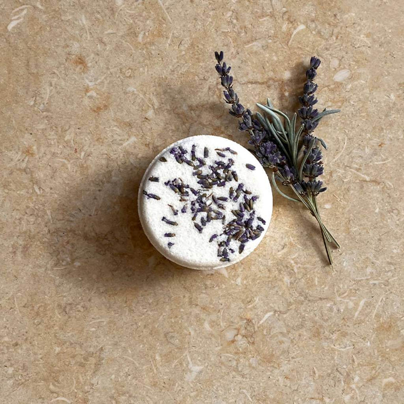 Lavender bath bomb with sprigs of lavender