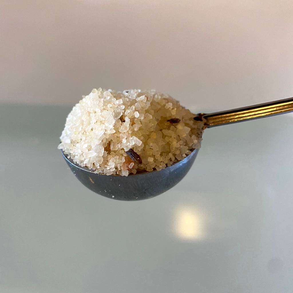 Scoop of vegan rose and lavender bath salts